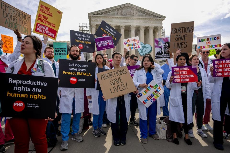 A group of doctors join abortion rights supporters at a rally outside the Supreme Court on April 24, 2024 in Washington, DC (Getty Images)