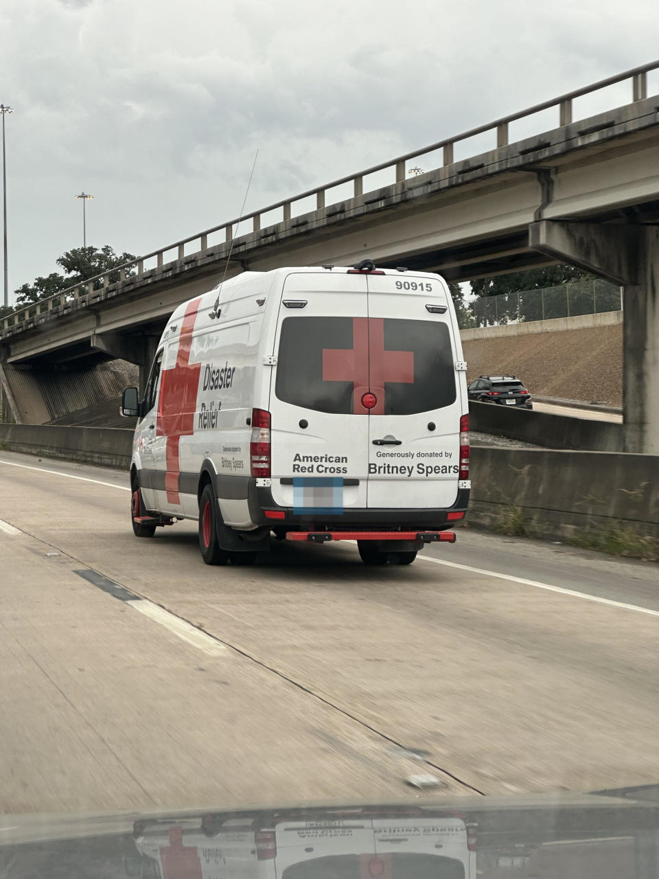 American Red Cross Disaster Relief Bus on Highway, Sponsored by Britney Spears