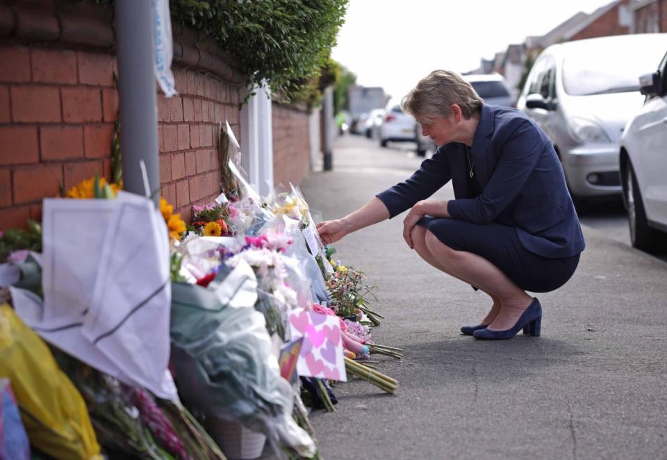 Home Secretary Yvette Cooper watches tributes at the crime scene in Hart Street (James Speakman/PA Wire)