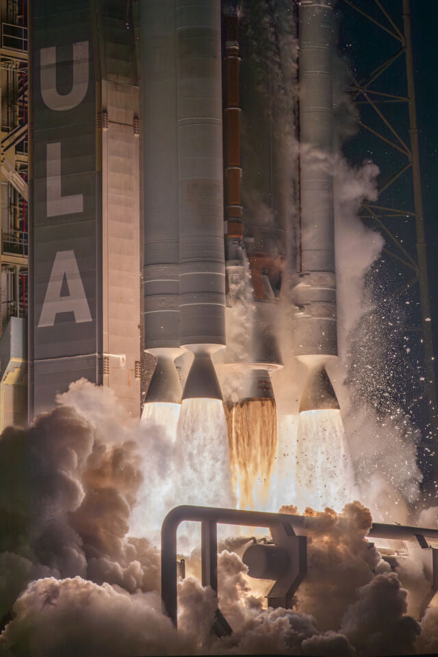 A cluster of solid rocket motors surrounds the RD-180 main engine as the Atlas V rocket lifts off from Cape Canaveral Space Force Station to begin the USSF-51 mission.