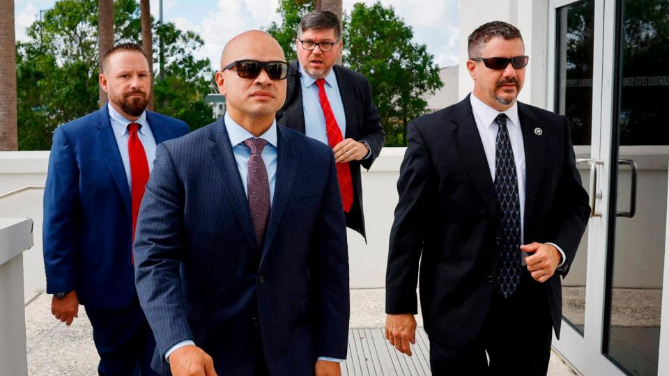 PHOTO: Walt Nauta (2L), an adviser to former President Donald Trump, arrives at the Alto Lee Adams Sr. courthouse in Fort Pierce, Florida, on May 22, 2024. (Marco Bello/AFP via Getty Images)