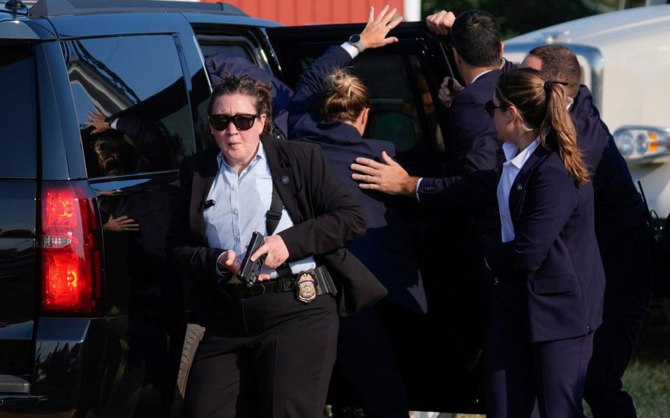 The Secret Service quickly removed Trump from the scene