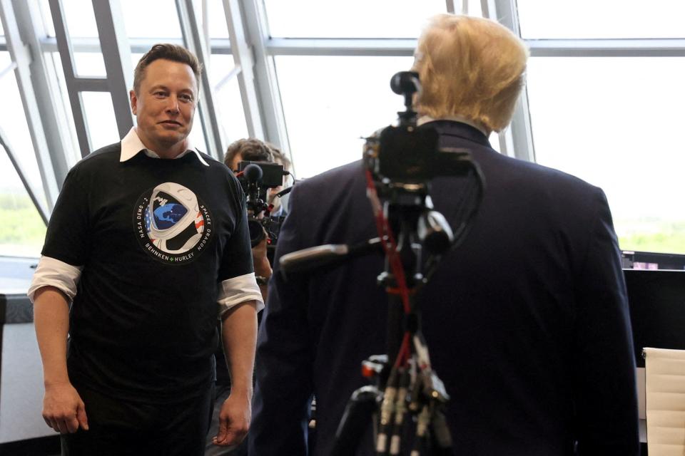 U.S. President Donald Trump and Elon Musk are seen in Firing Room Four after the launch of a SpaceX Falcon 9 rocket and Crew Dragon spacecraft during NASA's SpaceX Demo-2 mission to the International Space Station from NASA's Kennedy Space Center in Cape Canaveral, Florida, U.S., May 30, 2020.