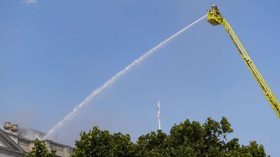 Firefighters work at the scene of a fire at Somerset House in London