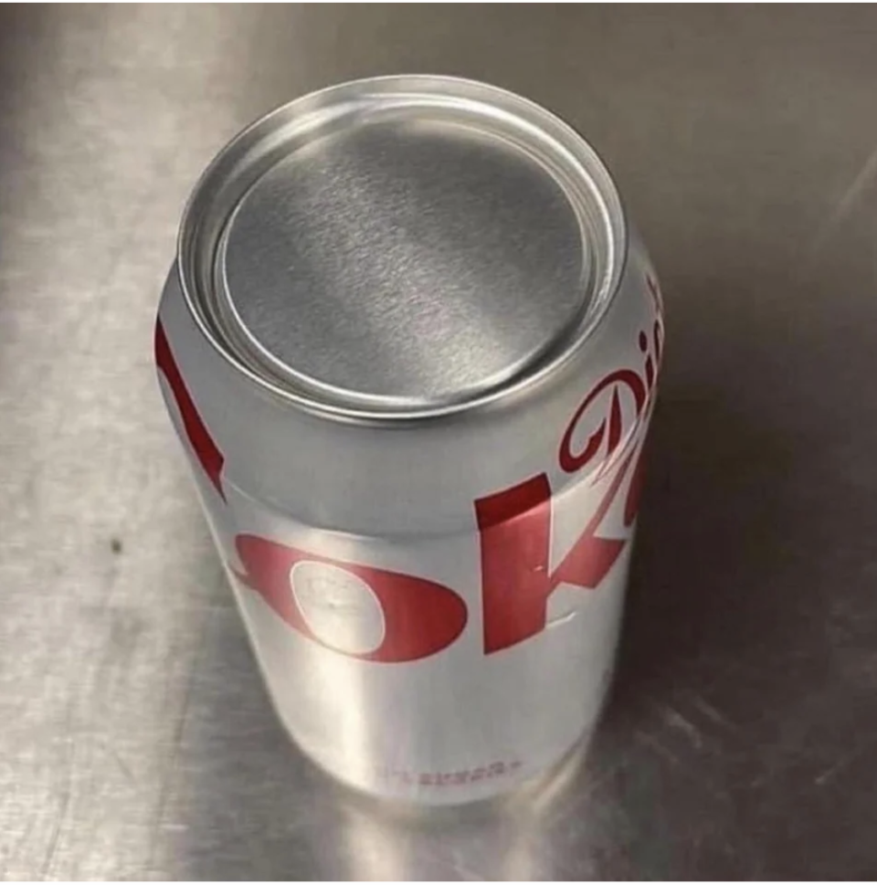 A can of Diet Coke turned wrong side up