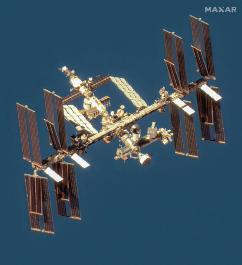 A commercial high-resolution Earth imaging satellite owned by Maxar captured this image of the International Space Station on June 7, with Boeing's Starliner capsule docked at the laboratory's forward gate (lower right).