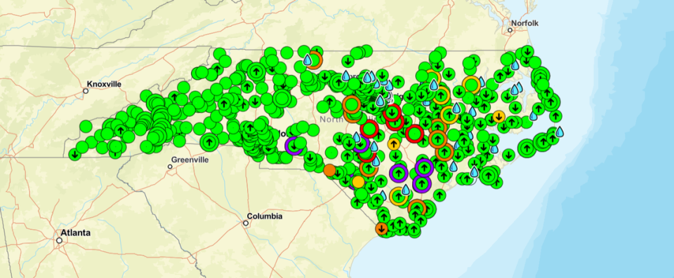 North Carolina's Flood Inundation Mapping and Alert Network on Wednesday showed six locations in eastern and southeastern NC likely to see major flooding from Tropical Storm Debby, marked by green dots circled in purple. At least another dozen, circled in red or orange, will see moderate or minor flooding.