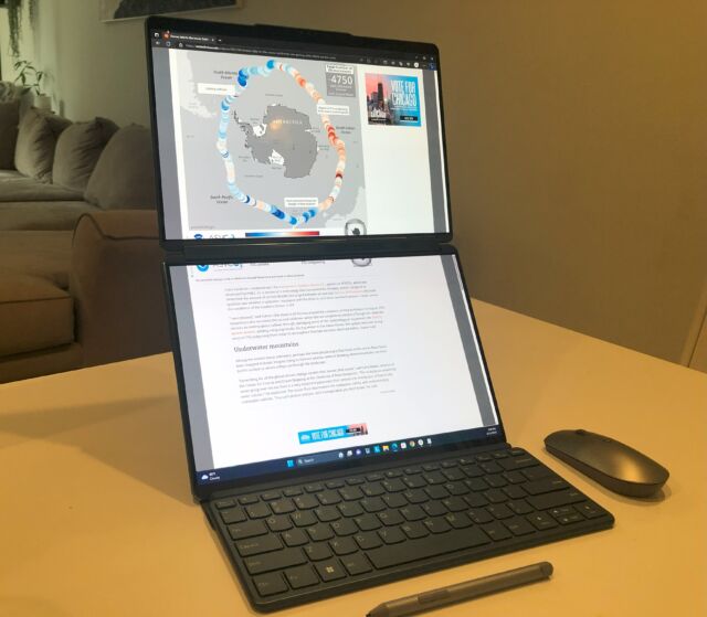 The photo shows the Yoga Book 9i with the Bluetooth keyboard disconnected.