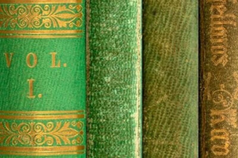 Composite image showing color variation of emerald green book cloth on book spines, likely the result of air pollution