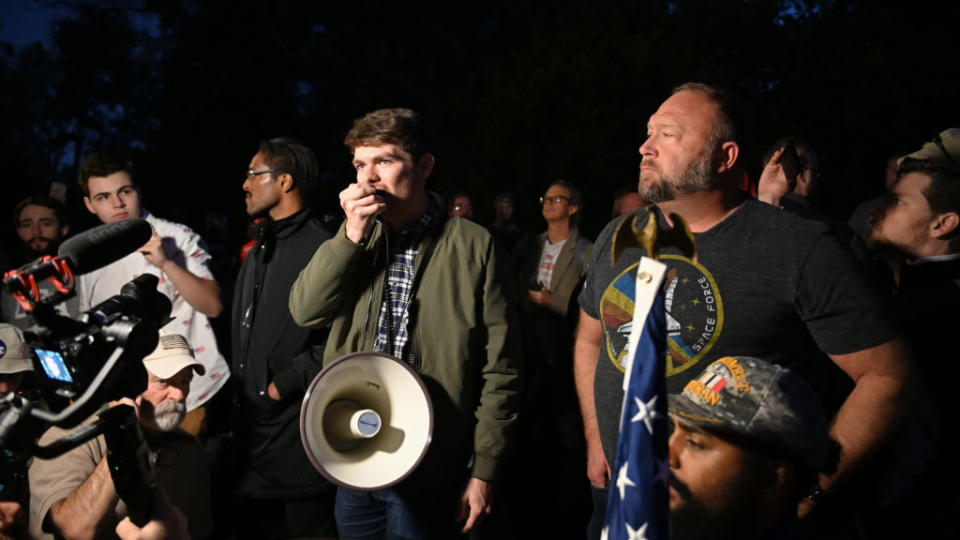 Nick Fuentes joins conspiracy theorists Alex Jones and Ali Alexander at a “Stop the Steal” rally at the Georgia governor’s mansion shortly after the 2020 election.