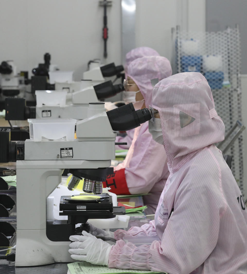 HUAI'AN, CHINA - APRIL 29, 2024 - A worker produces chips for mobile phones, cars and LED lighting at a workshop in Huai'an city, Jiangsu province, China, April 29, 2024. (Photo by Costfoto/NurPhoto via Getty Images)