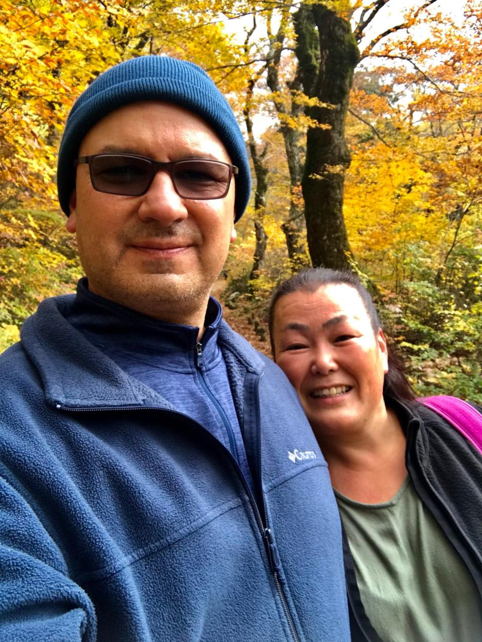 A man and his wife on a walking path.