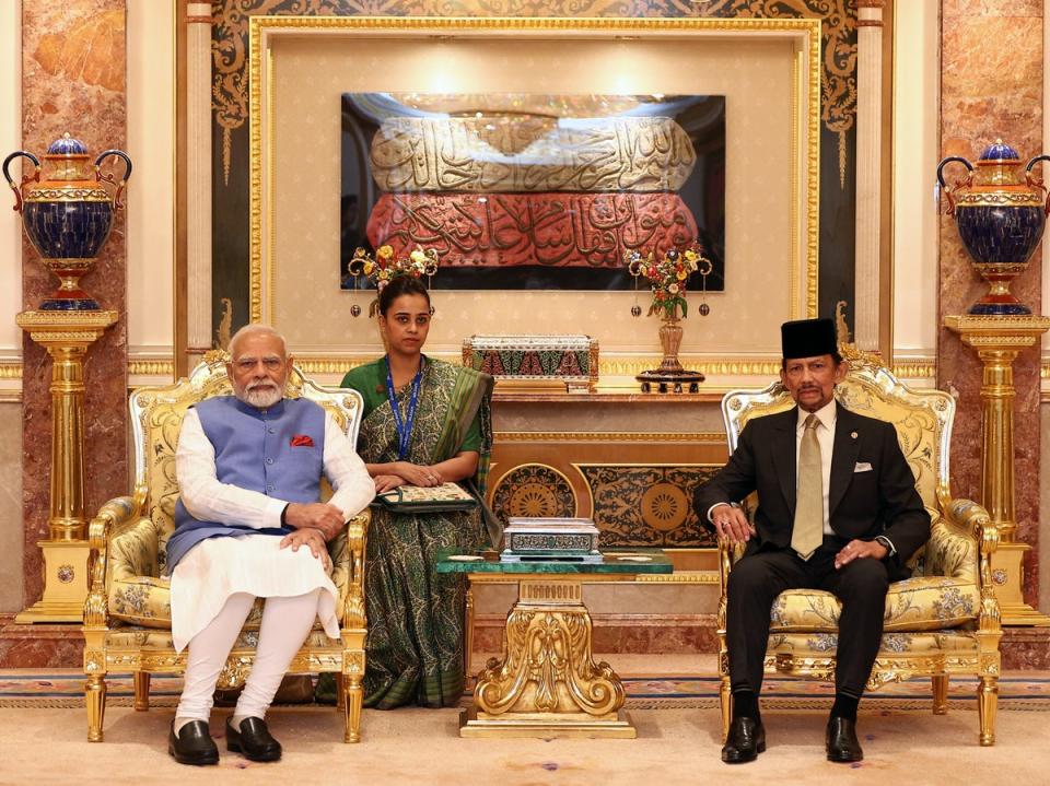 Indian Prime Minister Narendra Modi (L) and Brunei Sultan Hassanal Bolkiah (R) pose for photos ahead of a gathering at Istana Nurul Iman in Bandar Seri Begawan on September 4, 2024 (AFP via Getty Images)