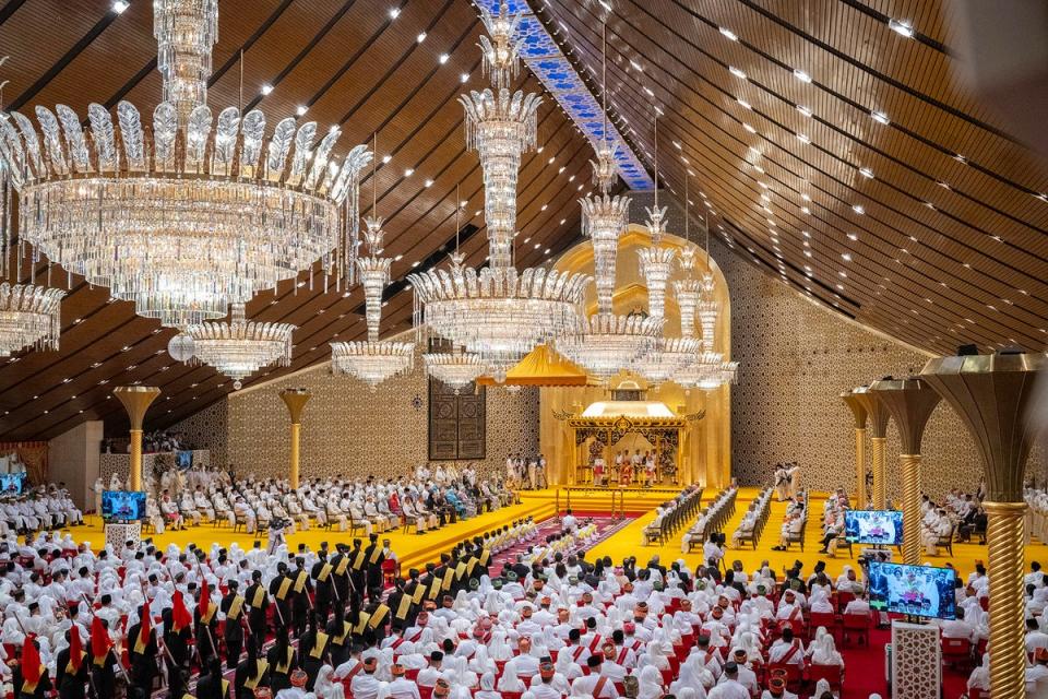 This photo taken by the Brunei Information Department shows the royal powder ceremony for Brunei Prince Abdul Mateen, center, at Istana Nurul Iman, prior to his wedding to Anisha Rosnah, in Bandar Seri Begawan, Brunei (via AP)