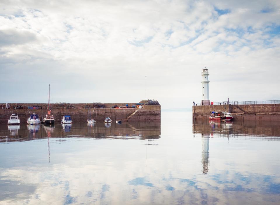 The lighthouse on the harbour walls of Newhaven, part of Edinburgh's Wardie Bay waterfront (Getty)