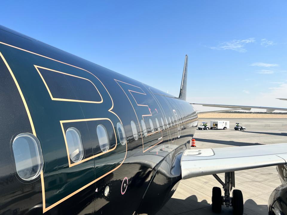 A view of the Beond logo on the black A319, seen from the aircraft entrance