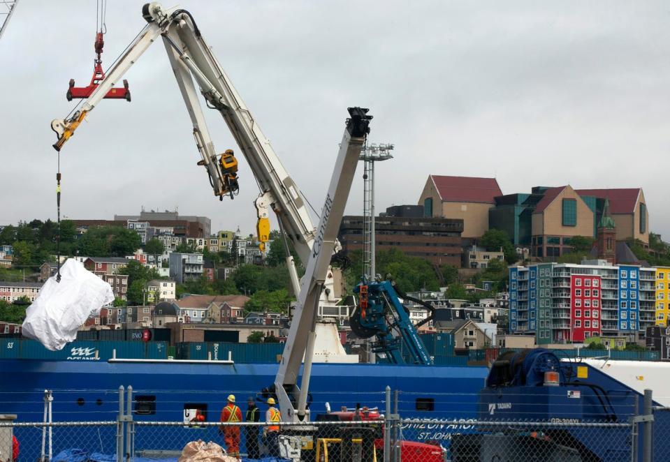 Debris from the Titan submarine, recovered from the seabed near the Titanic wreck, is unloaded from the Horizon Arctic ship at the Canadian Coast Guard pier in St. John's, Newfoundland, June 28, 2023. (AP)