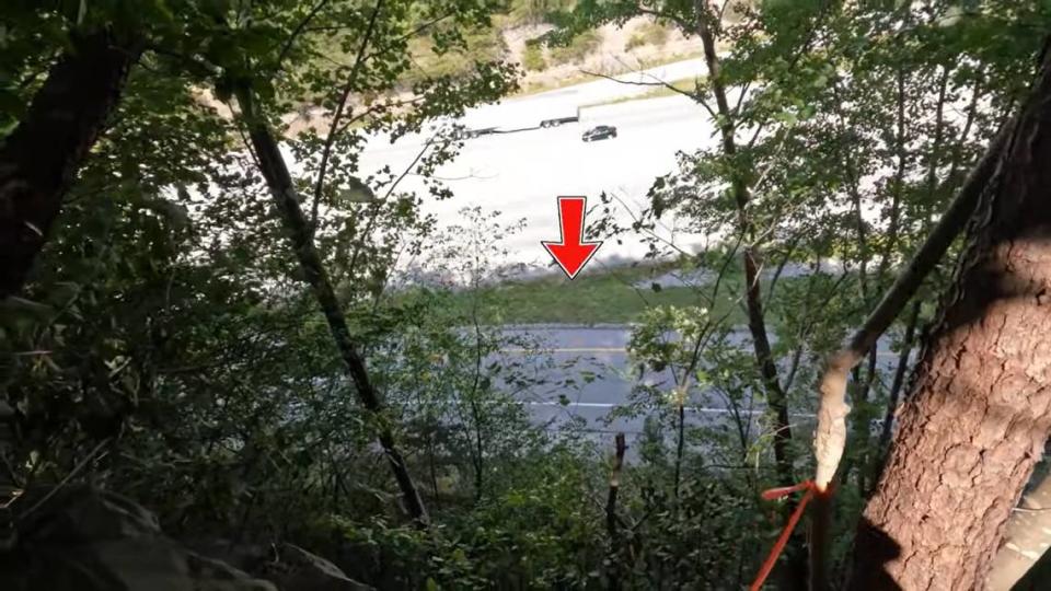 View of Exit 49 of Interstate 75 in southern Kentucky from the spot where Fred and Sheila McCoy say Joseph Couch shot at 12 vehicles on Sept. 7, 2024. The pair began hiking early in the day to reach the area and try to find Couch.