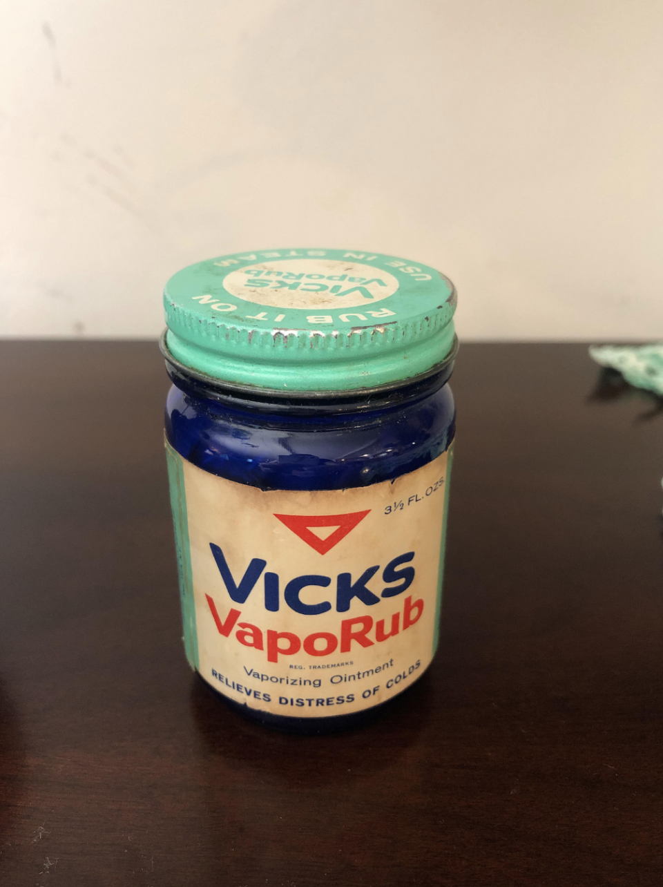 A jar of Vicks VapoRub vaporizing ointment, used to relieve the pain of a cold