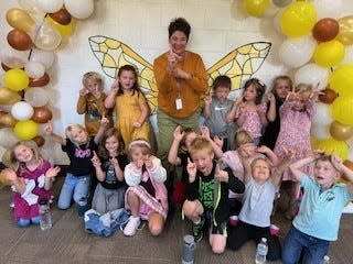 Ms. Welch poses with her first grade class during the first day of the 2024-2025 school year at Pellston Elementary School.