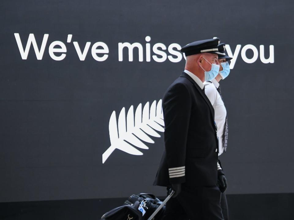 Air New Zealand pilots arrive at Sydney International Airport.