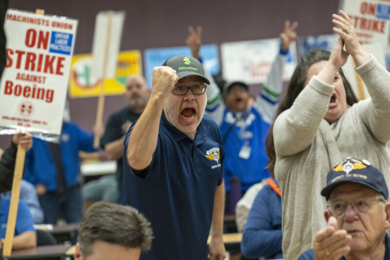 Union members cheer during a press conference after the counting of votes on the union contract at the IAM District 751 Main Union Hall in Seattle, Washington, U.S., Thursday, September 12, 2024. 