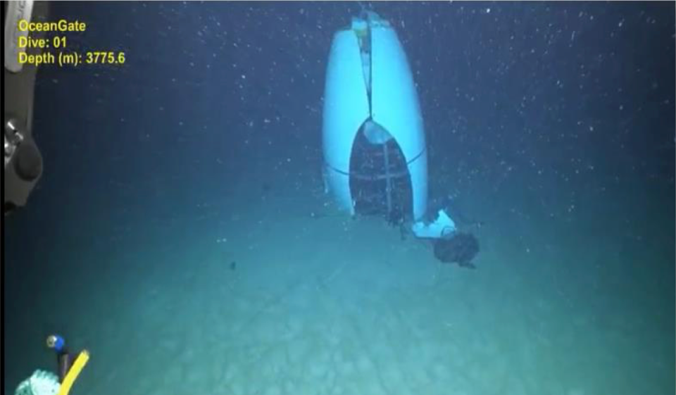 The Titan submarine was found on the seafloor on June 22, 2023, after days of searching after it imploded. New photos show it on the seafloor after it was discovered, and the lives of the five aboard were lost on the way to the Titanic wreck site. (ROV image of TITAN's tail cone. Source: Pelagic Research Services, June 2023)