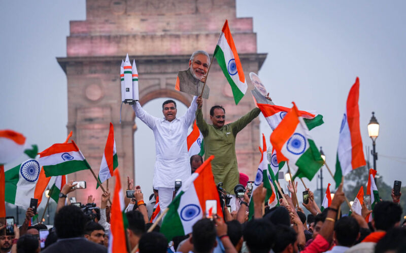 Parvesh Sahib Singh Verma and Virendra Sachdeva, two members of Narendra Modi's ruling BJP party, celebrate the landing of India's Chandrayaan 3 spacecraft on the moon on August 23, 2023.