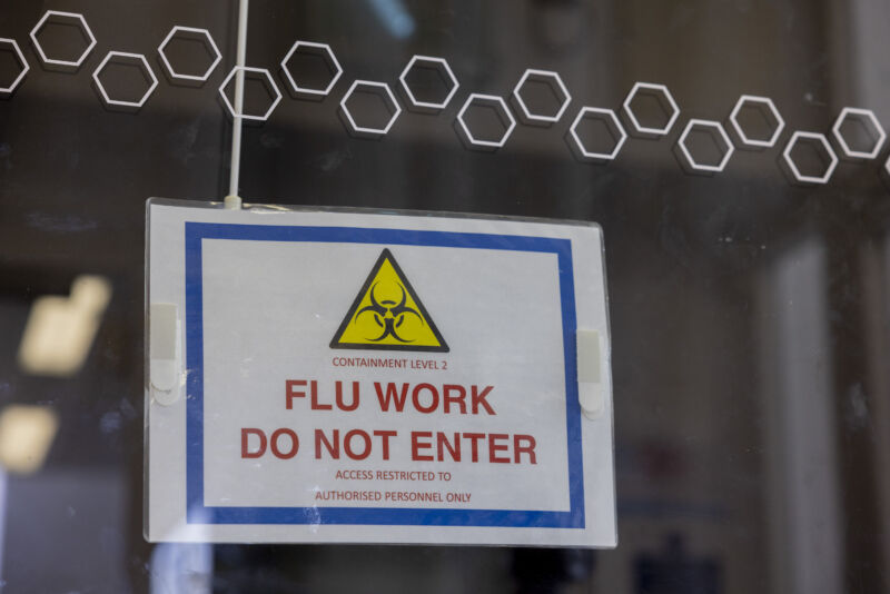 A warning sign outside a laboratory testing the H5N1 bird flu virus at the Pirbright Institute in Woking, UK, on ​​Monday, March 13, 2023. 