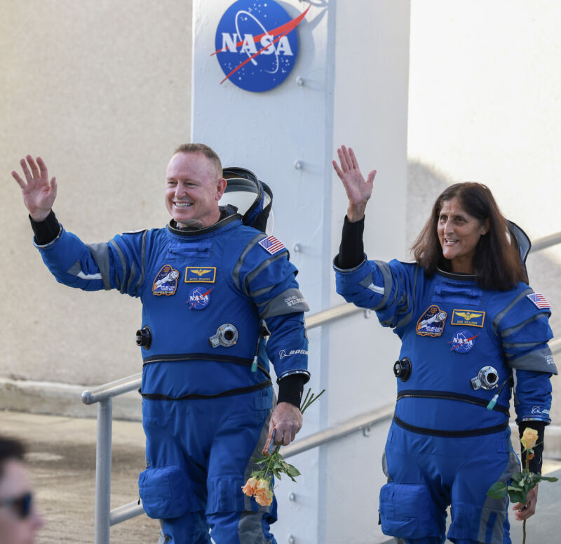 NASA astronauts Butch Wilmore and Suni Williams wave to their families, friends and NASA officials as they make their way to the launch pad June 5 to board Boeing's Starliner spacecraft.