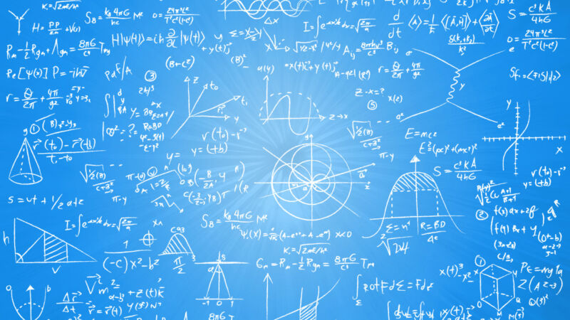 Equations on a board on a blue background.