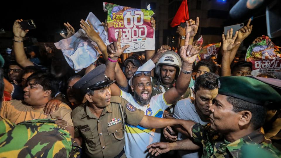 Supporters of newly elected President Anura Kumara Dissanayake cheer at the Electoral Commission after announcing his victory in the presidential election, in Colombo, Sri Lanka, September 22, 2024.