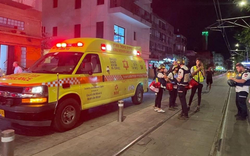 An ambulance was ready at the scene of the shooting on Tuesday evening