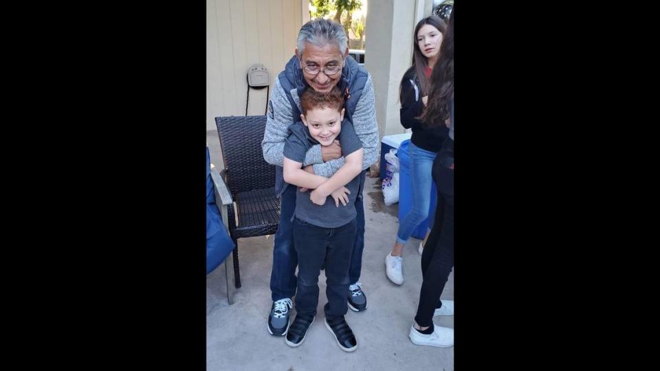 Jesus Salazar is photographed with his grandson Landon 'Canelo' Castillo in an undated photo. Salazar, 66, died on May 6, 2023 while working at Pitman Family Farms in Sanger, California.