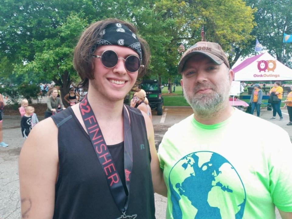 Missing Austin King (L) pictured with his father Brian King-Henke (family ceremony)