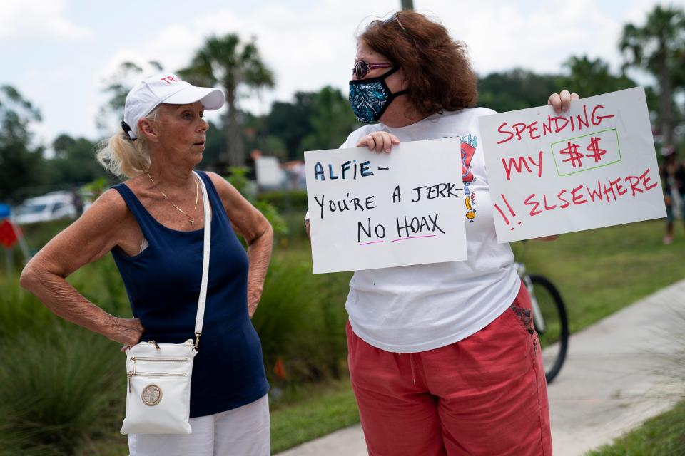 Women on either side of a protest argue outside the Oakes Farms Seed to Table Market on Saturday, June 13, 2020. The protest was sparked by an inflammatory Facebook post about COVID-19 and the Black Lives Matter movement from Oakes Farms Seed to Table Market owner Alfie Oakes, and was met by a counter-protest organized by Oakes.