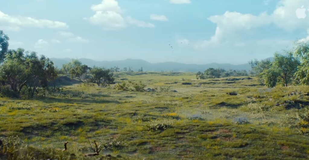 widescreen view of lush flat landscape against a blue sky