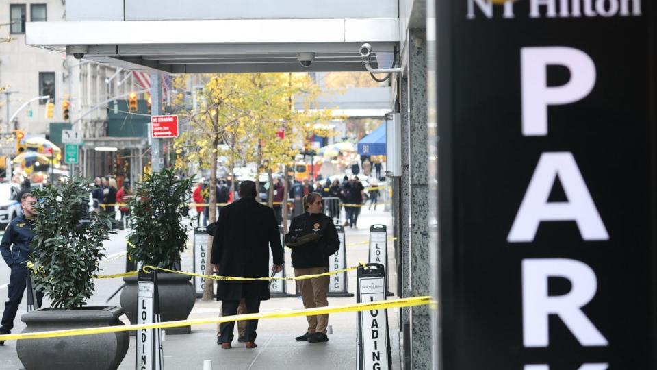 PHOTO: Police investigators at the scene where UnitedHealthcare CEO Brian Thompson was shot and killed in an apparent targeted attack while on his way to attend UnitedHealthcare's annual investor conference in New York, December 4, 2024. (Justin Lane/EPA via Shutterstock)