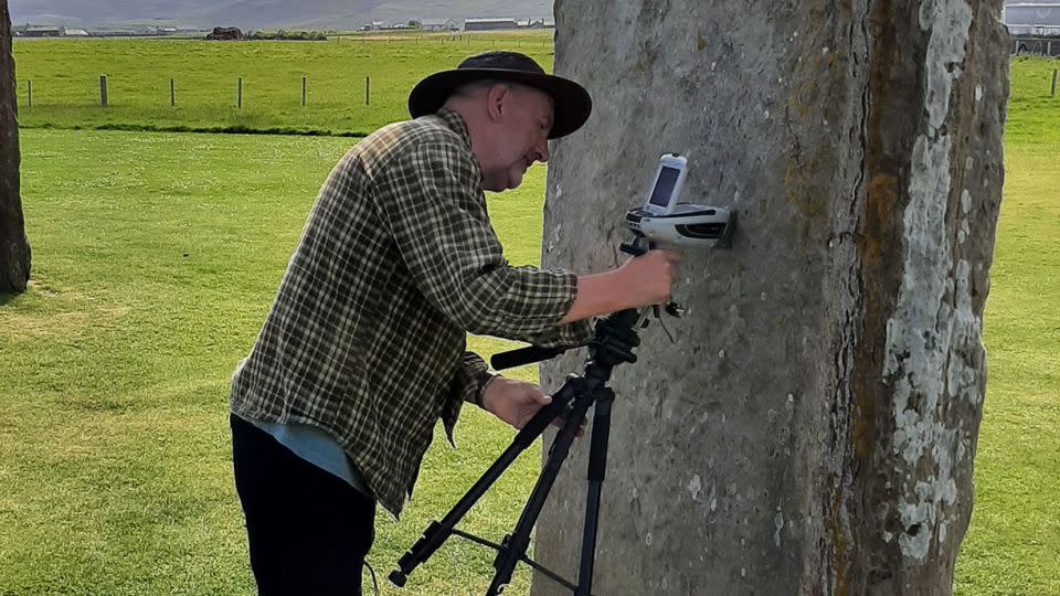 Study co-author Nick Pearce, professor of geography and earth sciences at Aberystwyth University, analyzes Neolithic stones in Orkney, an archipelago off the northeastern coast of Scotland. – Richard Bevins/Aberystwyth University