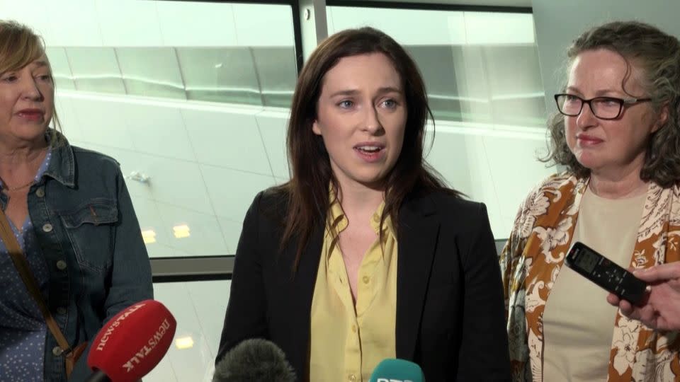 Tori Towey speaks to the media after arriving home at Dublin Airport on July 11, 2024 with her aunt Ann Flynn (left) and her mother Caroline (right). -David Young/PA