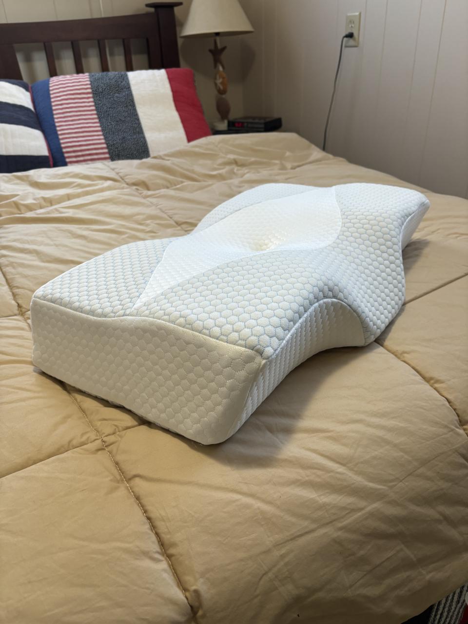 photo of Mkicesky cervical support pillow on bed