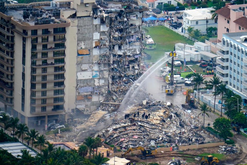 Rescue personnel work on the remains of the Champlain Towers South condo building, June 25, 2021, in Surfside, Florida (Copyright 2021 The Associated Press. All rights reserved.)