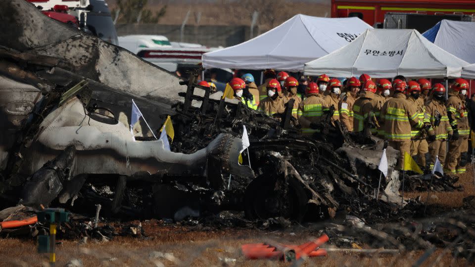 Rescue workers take part in a recovery operation at the site where a plane crashed after going off the runway at Muan International Airport in Muan, South Korea, on December 29, 2024. - Kim Hong-Ji/Reuters