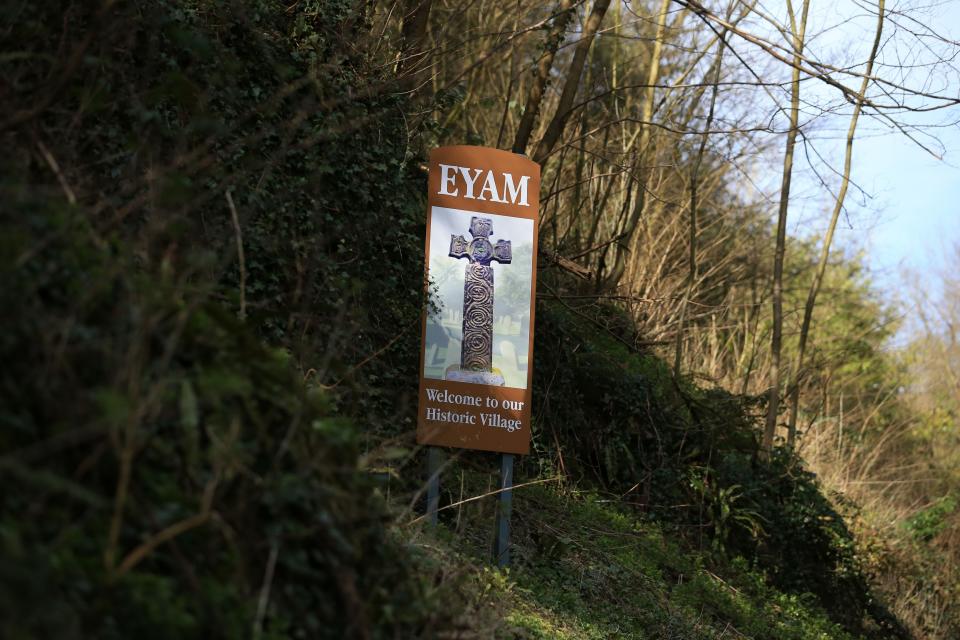 A sign welcomes people to the village of Eyam in Derbyshire, northern England on March 23, 2020. - In the 17th century, the residents of Eyam rid themselves of the plague by quarantining themselves. In recent days, in the midst of the novel coronavirus pandemic, this village in central England has seen red due to the influx of visitors defying health recommendations. (Photo by Lindsey Parnaby / AFP) / TO GO WITH AFP STORY BY LINDSEY PARNABY AND SYLVAIN PEUCHMAURD (Photo by LINDSEY PARNABY/AFP via Getty Images)