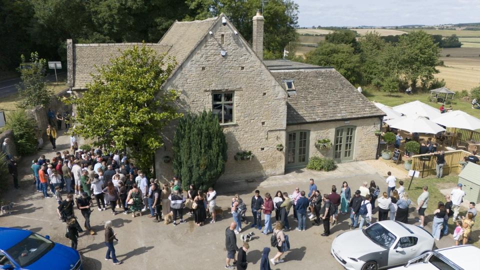 People queued outside The Farmer's Dog on the day it reopened (PA Wire)