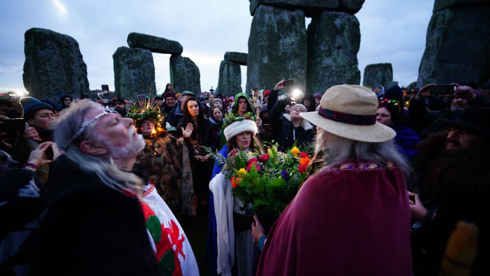 People take part in the winter solstice celebrations at Stonehenge on December 22, 2023. - Ben Birchall/PA Images/Getty Images/File