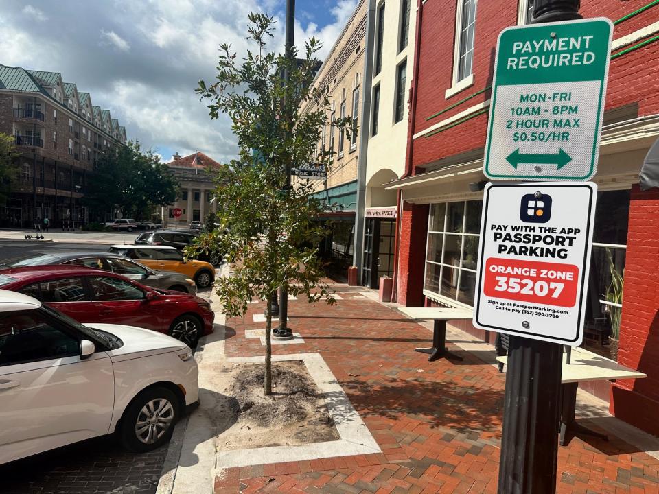 Cars are parked along Southeast First in downtown Gainesville in August.