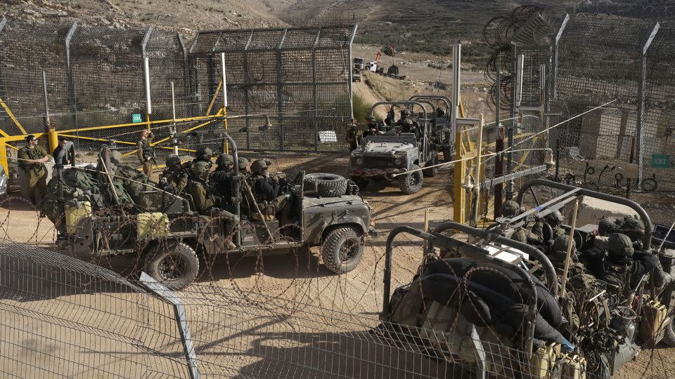 Israeli armored vehicles in the demilitarized buffer zone on the Golan Heights. - Matias Delacroix/AP