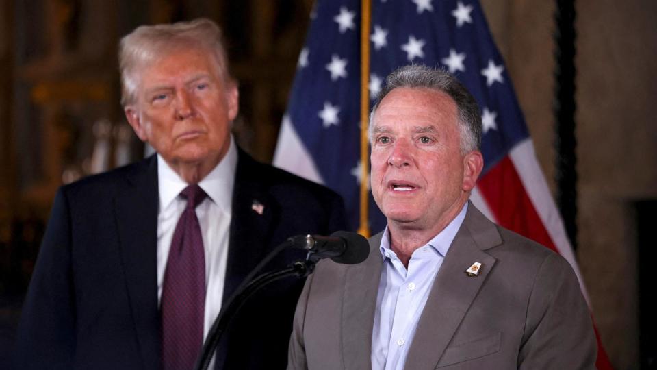 PHOTO: President-elect Donald Trump listens as Steve Witkoff speaks during a press conference at Mar-a-Lago, Jan. 7, 2024, in Palm Beach, Florida. (Carlos Barria/Reuters)