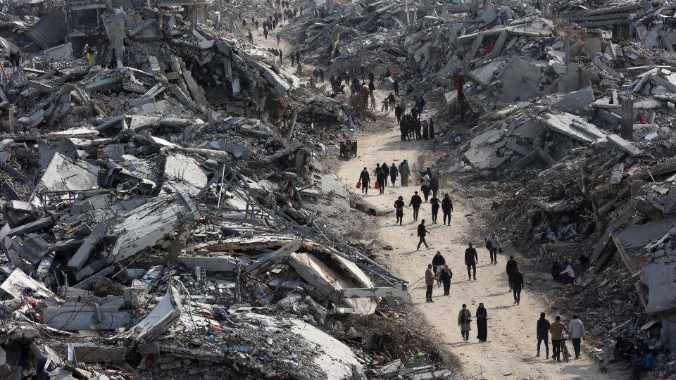 Displaced Palestinians return to the war-ravaged Jabalia refugee camp in the northern Gaza Strip on January 19, 2025, shortly before the ceasefire was implemented. – Omar Al-Qattaa/AFP/Getty Images